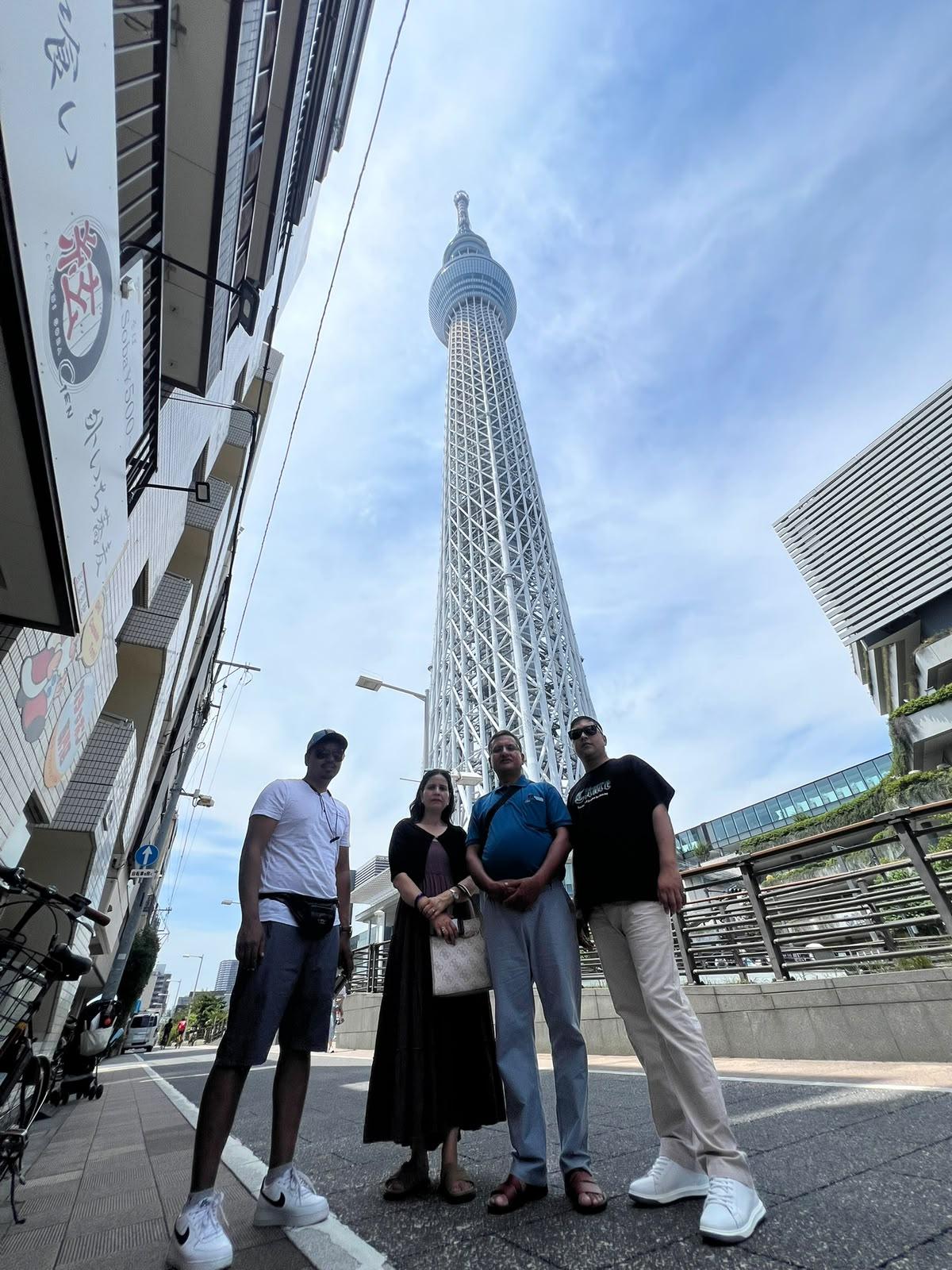 A family of four looking up at the Tokyo Skytree